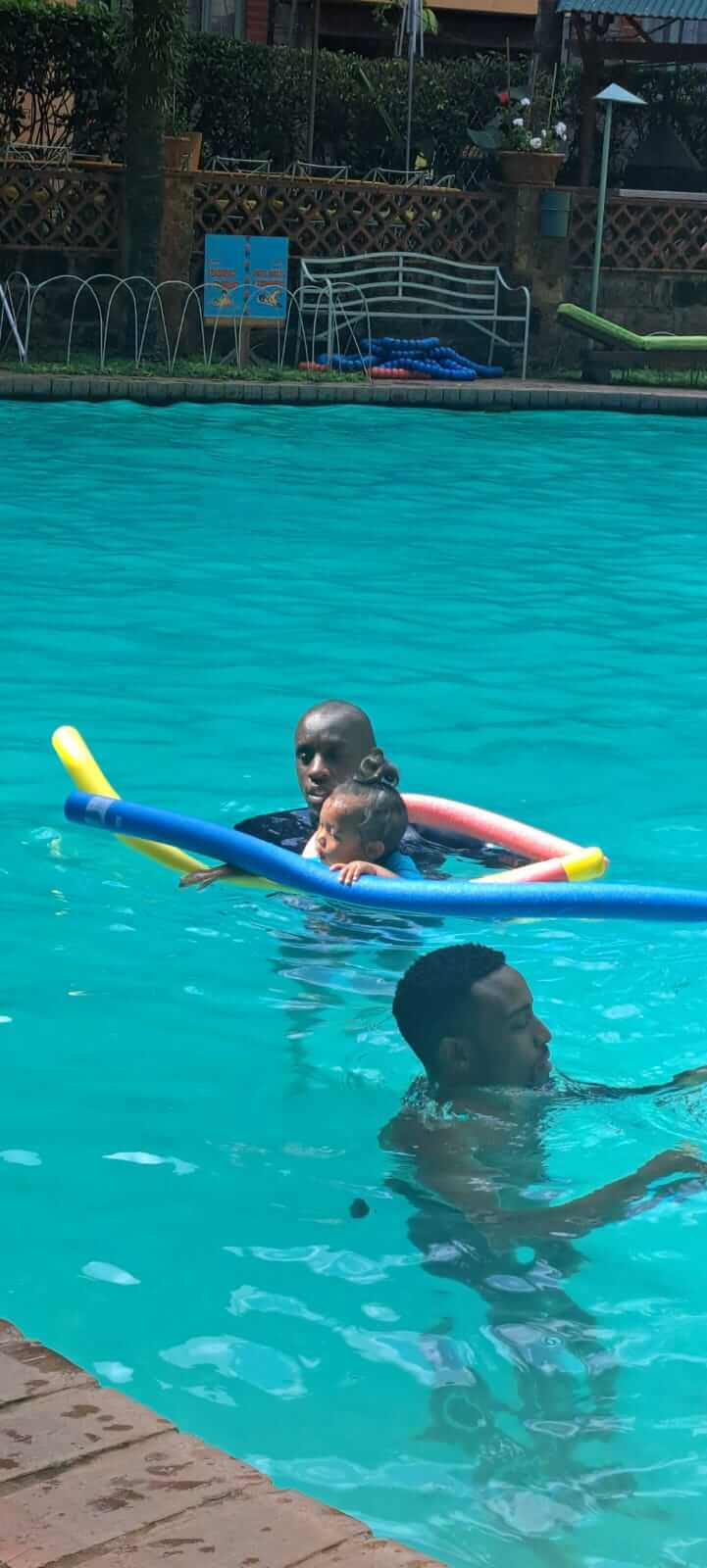 Child practicing safe floating with goggles